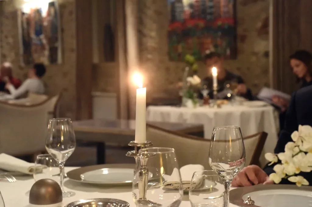 Candlelit table laid for dinner